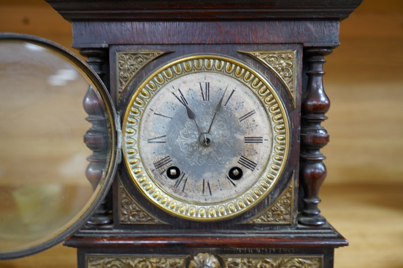 A late Victorian oak eight day mantel clock, striking on a coiled gong, height 26.5cm. Condition - fair, wear and oxidisation to dial.